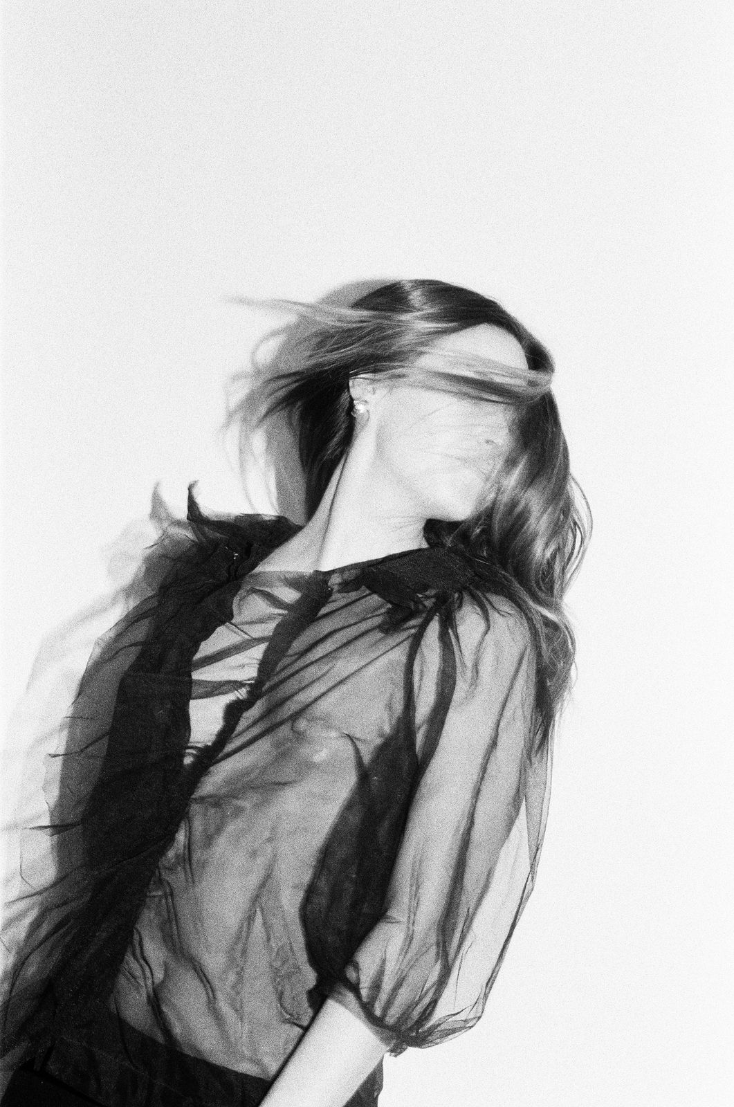 Studio portrait in motion, black and white film
